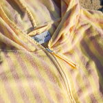 yellow and pink stripe poncho