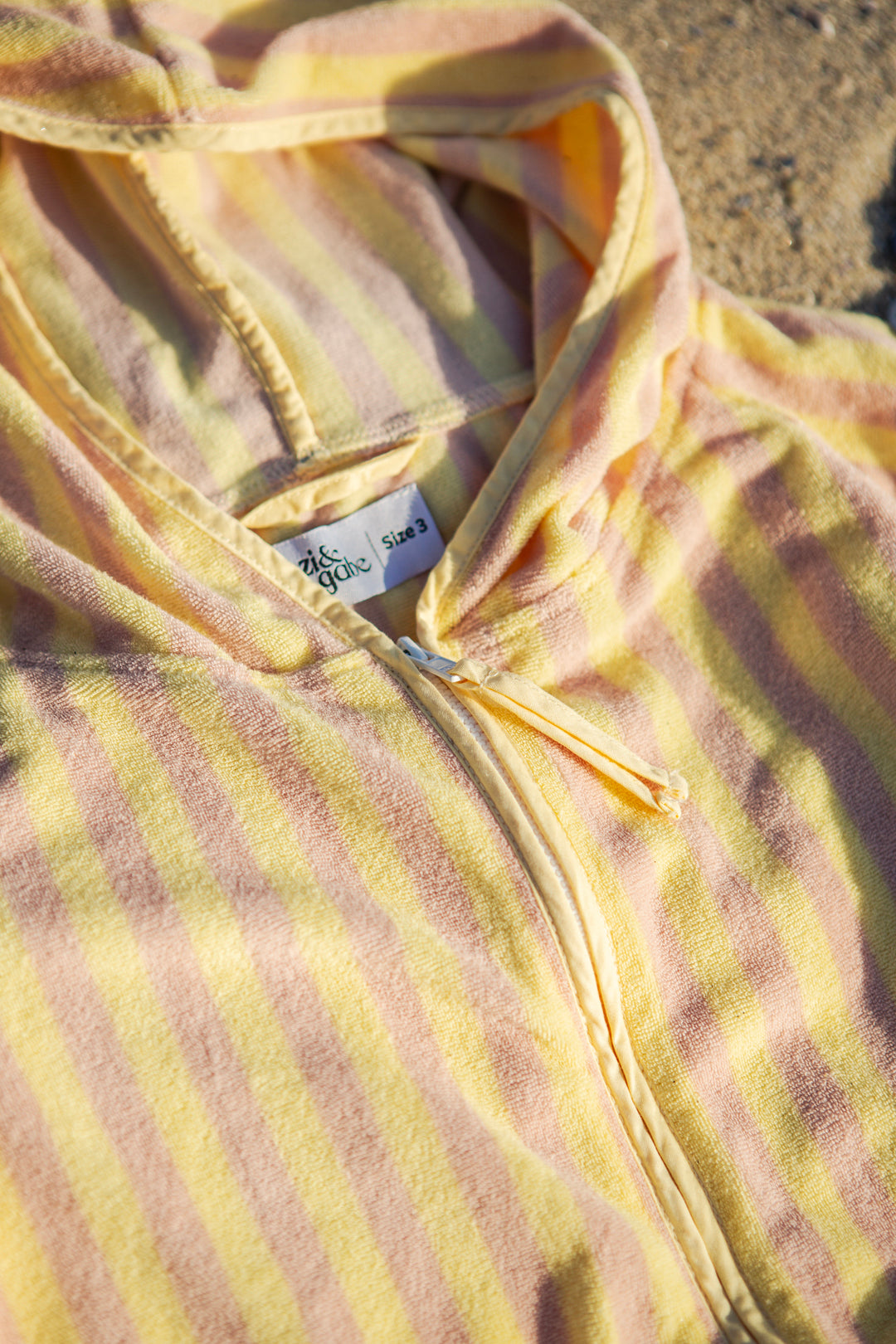 yellow and pink stripe poncho